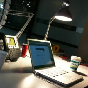 Students working on laptops in a shared lab